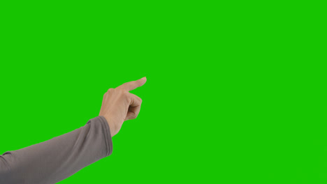 Studio-Close-Up-Shot-Of-Woman-Pretending-To-Press-Buttons-Against-Green-Screen